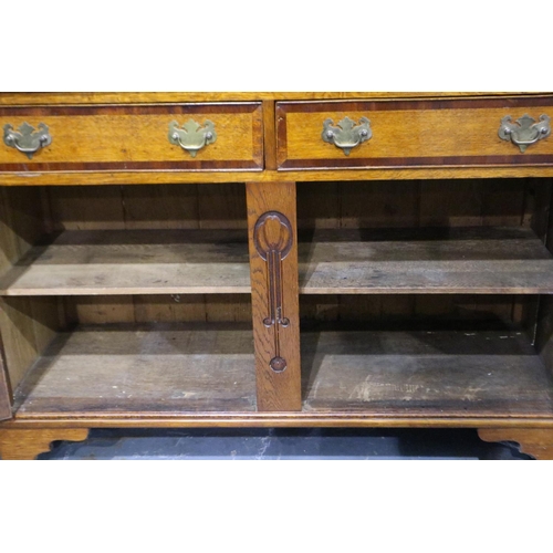 3095 - Art Nouveau cross banded dresser with two cupboards and two drawers with carved decoration by W.E Gr... 