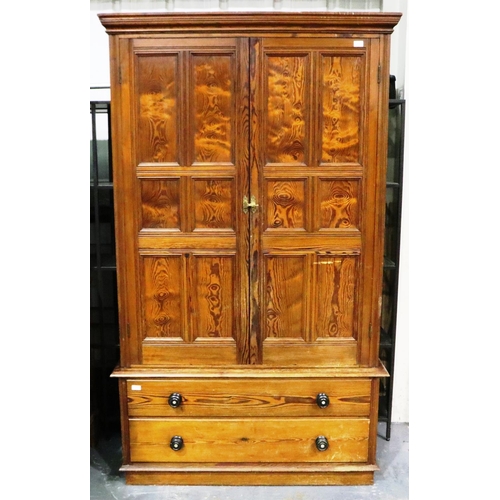 3096 - Pitch pine linen press with two lower drawers, 126 x 44 x 208 cm H. Standard usage marks to interior... 