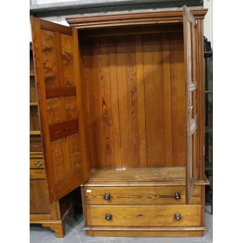 3096 - Pitch pine linen press with two lower drawers, 126 x 44 x 208 cm H. Standard usage marks to interior... 