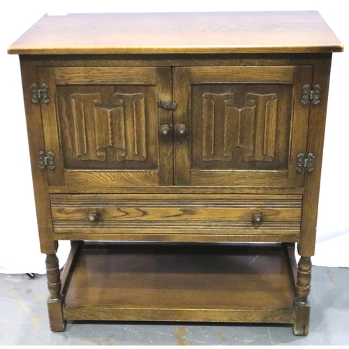 3099 - Oak two door cupboard with drawer below with linenfold decoration, 79 x 41 x 85 cm H. Not available ... 