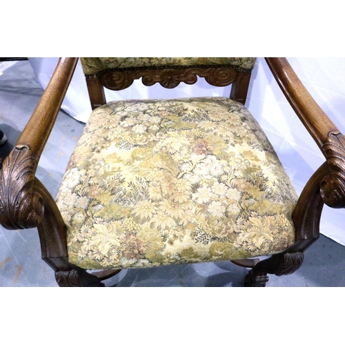 3100 - Oak framed tapestry upholstered arm chair with claw feet and cross stretcher. Not available for in-h... 