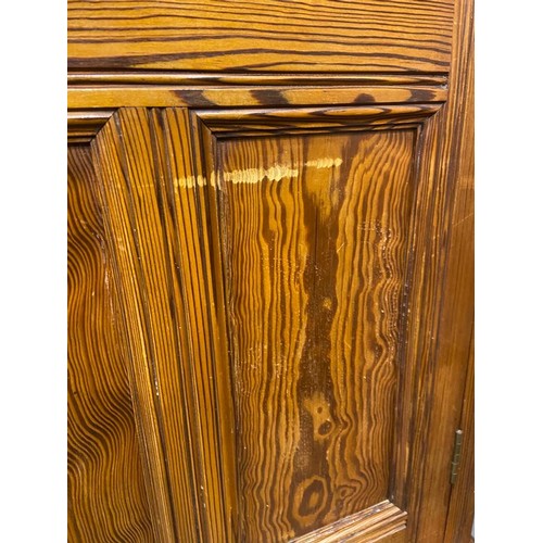 3096 - Pitch pine linen press with two lower drawers, 126 x 44 x 208 cm H. Standard usage marks to interior... 