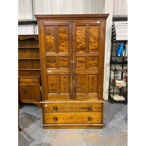 3096 - Pitch pine linen press with two lower drawers, 126 x 44 x 208 cm H. Standard usage marks to interior... 