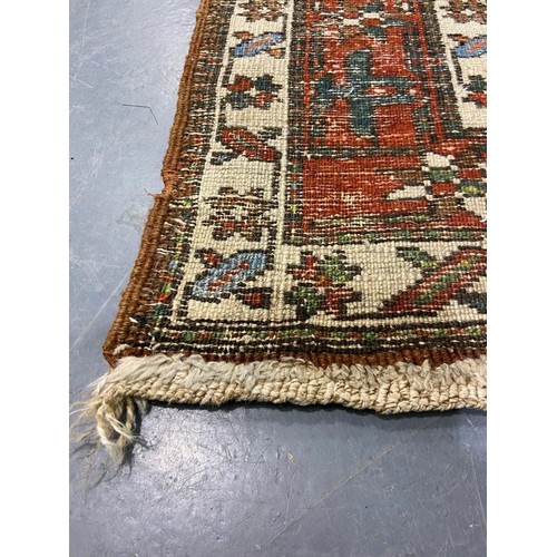 3071 - Large woollen runner, 95 x 455 cm. fading to array tassels are missing on one end, small tears to ed... 