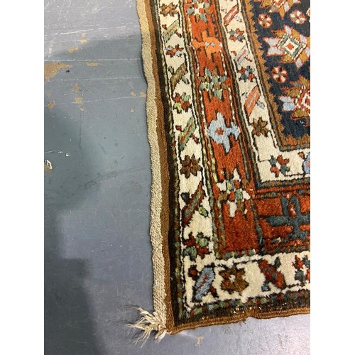 3071 - Large woollen runner, 95 x 455 cm. fading to array tassels are missing on one end, small tears to ed... 