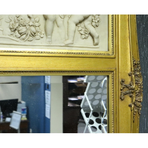 2071 - A 20th century gilt framed hall mirror with resin cherub panel, overall 60 x 115 cm. Not available f... 