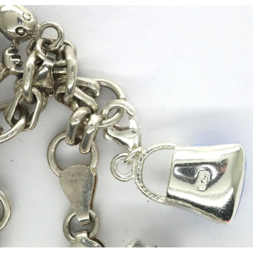 19 - Silver charm bracelet with eleven charms, L: 18 cm, 15g. P&P Group 1 (£14+VAT for the first lot and ... 