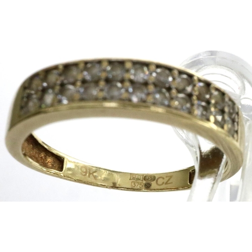 23 - 9ct gold ring set with CZ stones, size L/M, 1.4g. P&P Group 1 (£14+VAT for the first lot and £1+VAT ... 