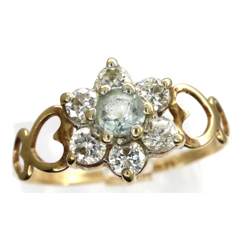 26 - 9ct gold flower ring set with CZ stones, size P, 1.1g with pierced heart shoulders. P&P Group 1 (£14... 