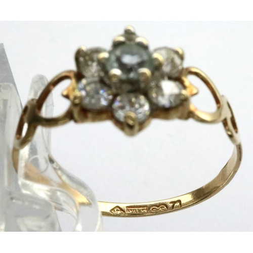 26 - 9ct gold flower ring set with CZ stones, size P, 1.1g with pierced heart shoulders. P&P Group 1 (£14... 