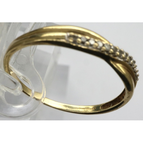 33 - 9ct gold crossover ring set with diamonds, size P, 1.1g. P&P Group 1 (£14+VAT for the first lot and ... 