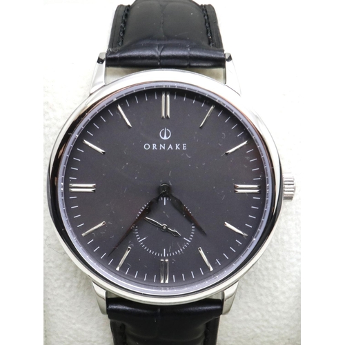 45 - Ornake: new old stock gents wristwatch with black dial, battery required. P&P Group 1 (£14+VAT for t... 