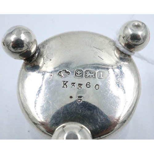 78 - Hallmarked silver pepperette on three supports, Birmingham assay 1910, H: 60 mm, 15g. Dented to body... 