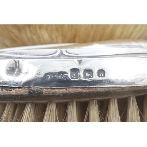 80 - Two hallmarked silver backed brushes and a hallmarked silver handled shoe horn. P&P Group 2 (£18+VAT... 