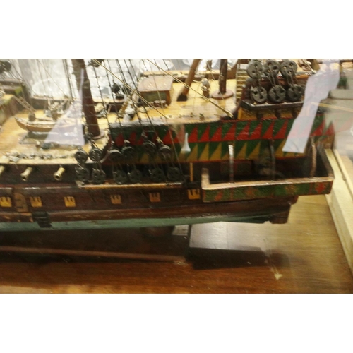 397 - Glass cased handmade wooden model of a 17th century three most sailing ship, museum quality approxim... 