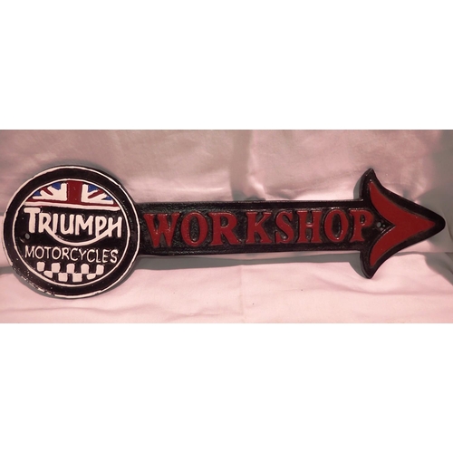 1071 - Cast iron Triumph workshop arrow, L: 40 cm. P&P Group 2 (£18+VAT for the first lot and £3+VAT for su... 