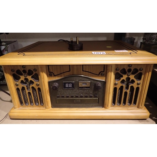 1075 - Oak cased record CD/tape/radio. All electrical items in this lot have been PAT tested for safety and... 