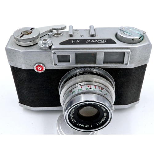 175 - Two vintage film cameras, a Konica EEMatic deluxe rangefinder and a Pal M4, both in leather cases an... 