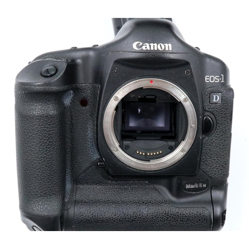 176 - Canon EOS 1D Mark IIN digital camera with charger and strap in camera bag. Appears to be in full wor... 