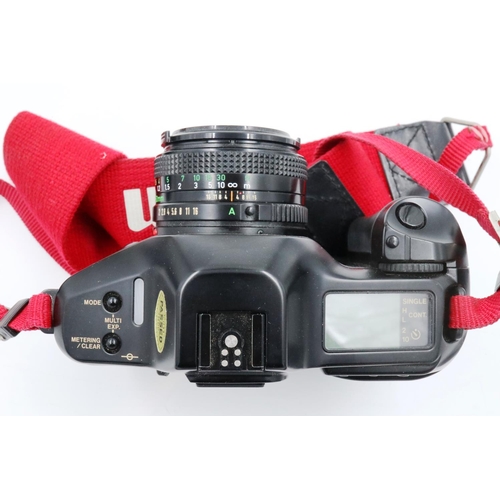 181 - Canon T90 camera with lenses in a hard case. P&P Group 2 (£18+VAT for the first lot and £3+VAT for s... 