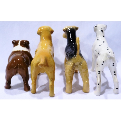 243 - Four Beswick dogs, L: 13 cm, no cracks or chips. P&P Group 2 (£18+VAT for the first lot and £3+VAT f... 