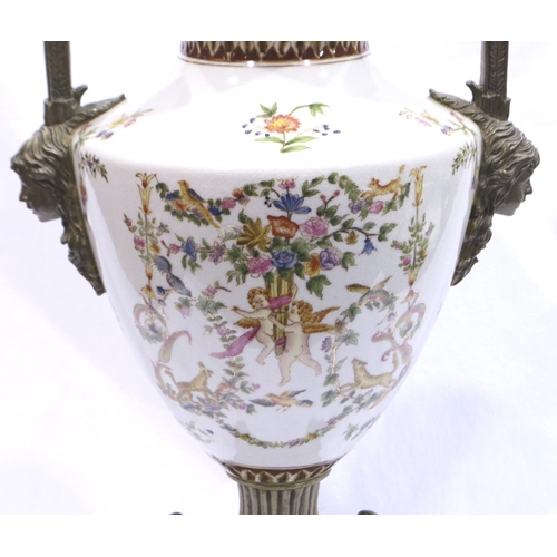 281 - Brass and ceramic twin handled urn with hand painted Cherub design, H: 50 cm, age related crazing bu... 