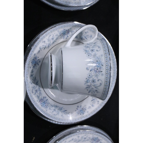 294 - Substantial Noritake dinner and teaware in the Blue Hill pattern (109) including a cake plate, no ch... 