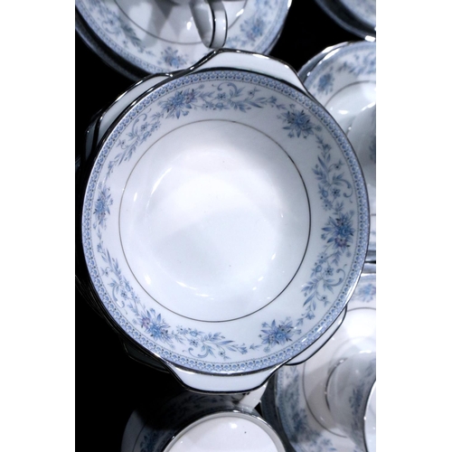 294 - Substantial Noritake dinner and teaware in the Blue Hill pattern (109) including a cake plate, no ch... 