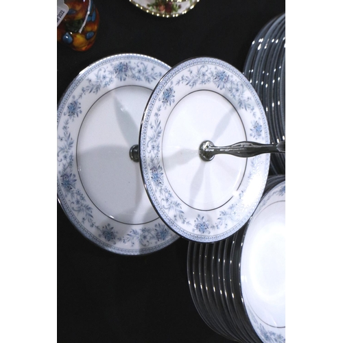 294 - Substantial Noritake dinner and teaware in the Blue Hill pattern (109) including a cake plate, no ch... 