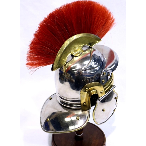 363 - Model Roman Legionnaires helmet on stand, H: 20 cm. P&P Group 3 (£25+VAT for the first lot and £5+VA... 