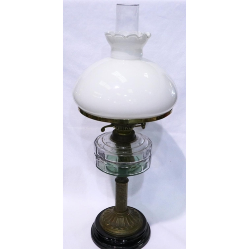 369 - Brass mounted paraffin lamp on a wooden base, H: 67 cm. Not available for in-house P&P