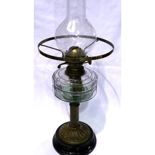 369 - Brass mounted paraffin lamp on a wooden base, H: 67 cm. Not available for in-house P&P