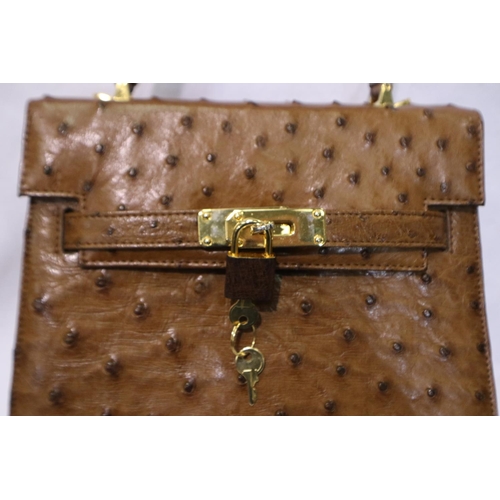 378 - Ostrich leather handbag and a Gucci dust bag. Handbag appears in unused condition, no fading/ tears,... 