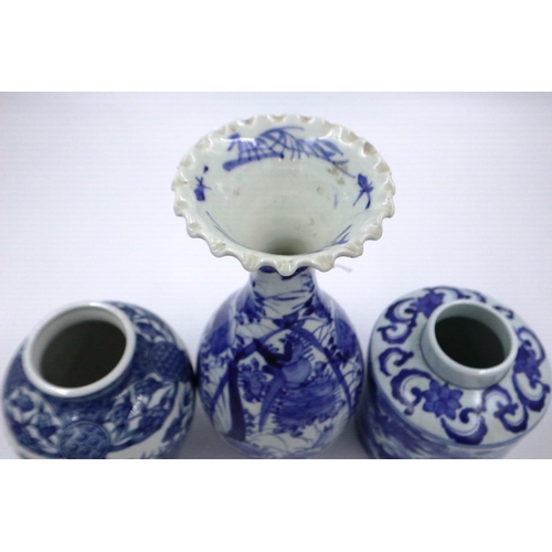 189 - Three Chinese blue and white vases, largest H: 29 cm, one vase with chips to the inside, others with... 