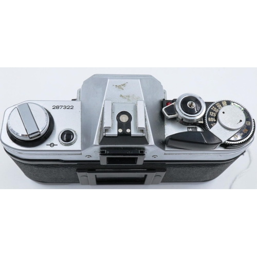 160 - Canon AE-1 35mm SLR camera body with instruction book. P&P Group 1 (£14+VAT for the first lot and £1... 