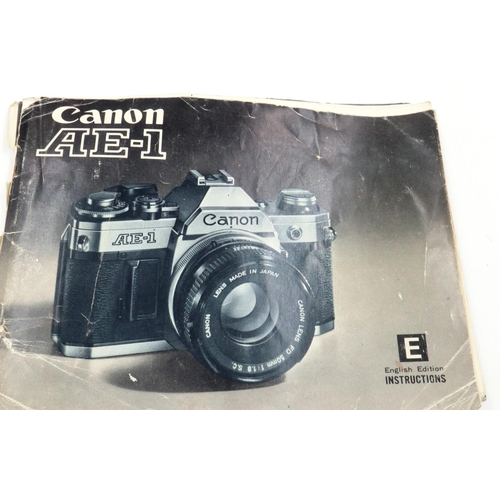 160 - Canon AE-1 35mm SLR camera body with instruction book. P&P Group 1 (£14+VAT for the first lot and £1... 