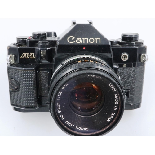 162 - Canon A-1 35mm SLR camera body with Canon 1:18 SC lens and instruction manual. P&P Group 1 (£14+VAT ... 