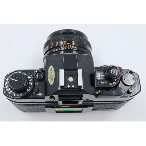 162 - Canon A-1 35mm SLR camera body with Canon 1:18 SC lens and instruction manual. P&P Group 1 (£14+VAT ... 