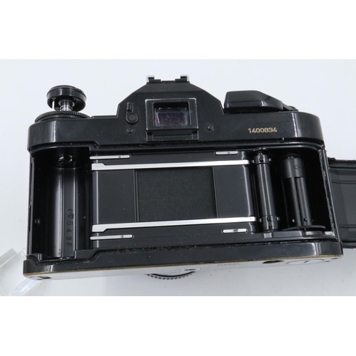 162 - Canon A-1 35mm SLR camera body with Canon 1:18 SC lens and instruction manual. P&P Group 1 (£14+VAT ... 