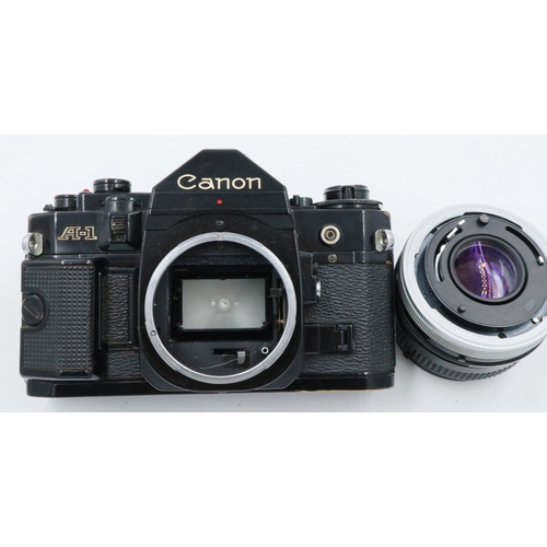 162 - Canon A-1 35mm SLR camera body with Canon 1:18 SC lens and instruction manual. P&P Group 1 (£14+VAT ... 