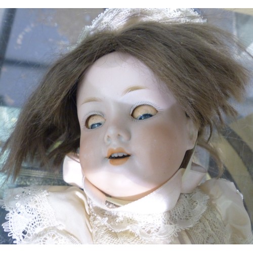 1064 - Quantity of porcelain and wooden dolls. Not available for in-house P&P