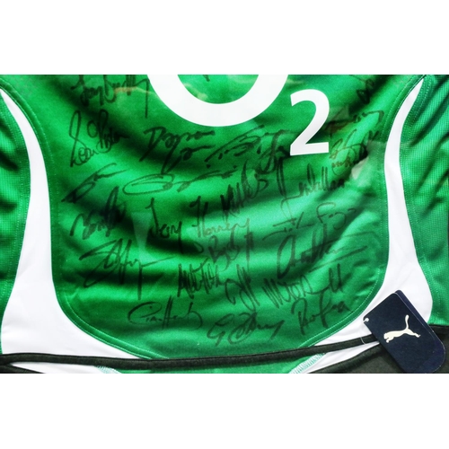 2042 - Framed IRFU green Puma shirt, O2, signed by the 2010 team, 103 x 89 cm. P&P Group 1 (£14+VAT for the... 