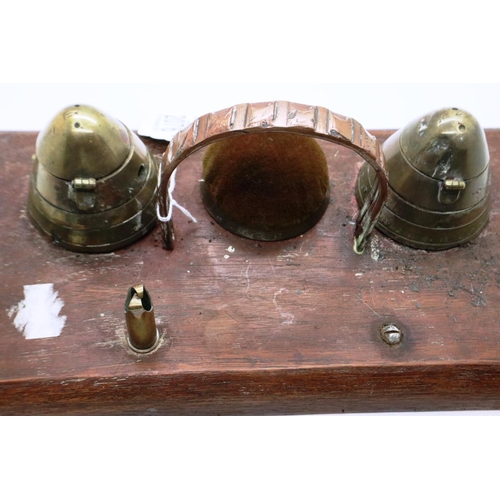 2076 - A trench art desk stand comprising two shell fuses converted to inkwells and blotter, with faults.  ... 