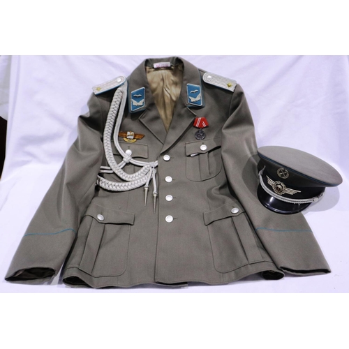 2110 - An East German NVA Luftwaffe lieutenant uniform, comprising tunic with awards and aiguillette, with ... 