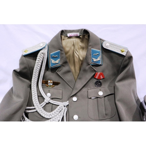 2110 - An East German NVA Luftwaffe lieutenant uniform, comprising tunic with awards and aiguillette, with ... 