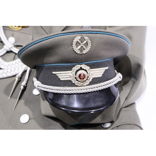 2110 - An East German NVA Luftwaffe lieutenant uniform, comprising tunic with awards and aiguillette, with ... 