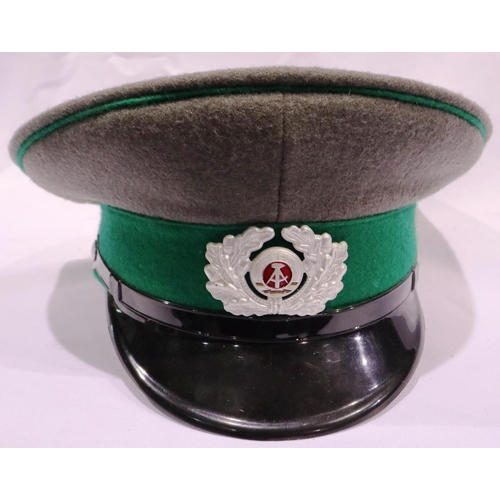 2117 - An East German NVA Border Troops enlisted mans tunic, trousers and visor cap. P&P Group 3 (£25+VAT f... 