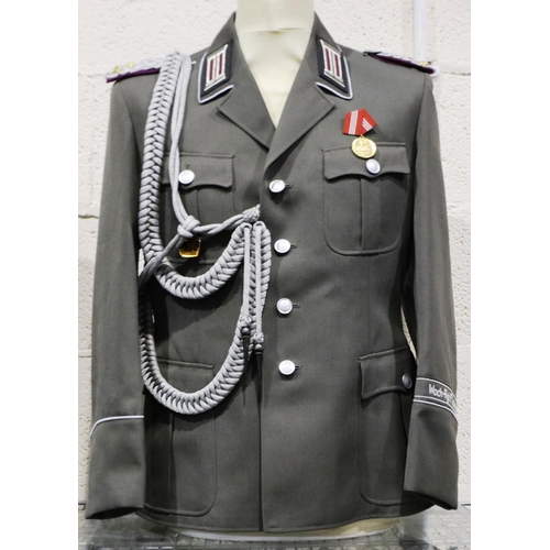 2120 - An East German NVA Colonels uniform tunic, with awards and aiguillette. P&P Group 3 (£25+VAT for the... 