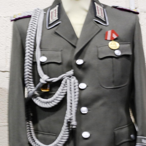 2120 - An East German NVA Colonels uniform tunic, with awards and aiguillette. P&P Group 3 (£25+VAT for the... 