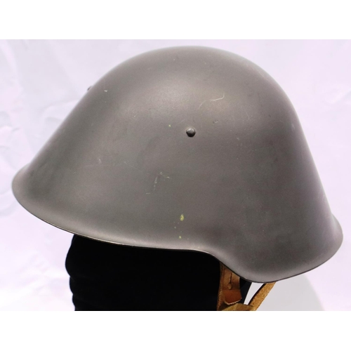 2124 - An East German NVA steel helmet with leather liner. P&P Group 2 (£18+VAT for the first lot and £3+VA... 